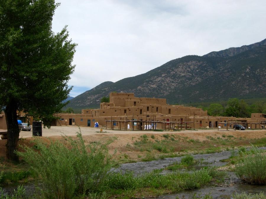 Taos Pueblo beside the Rio Pueblo stream.