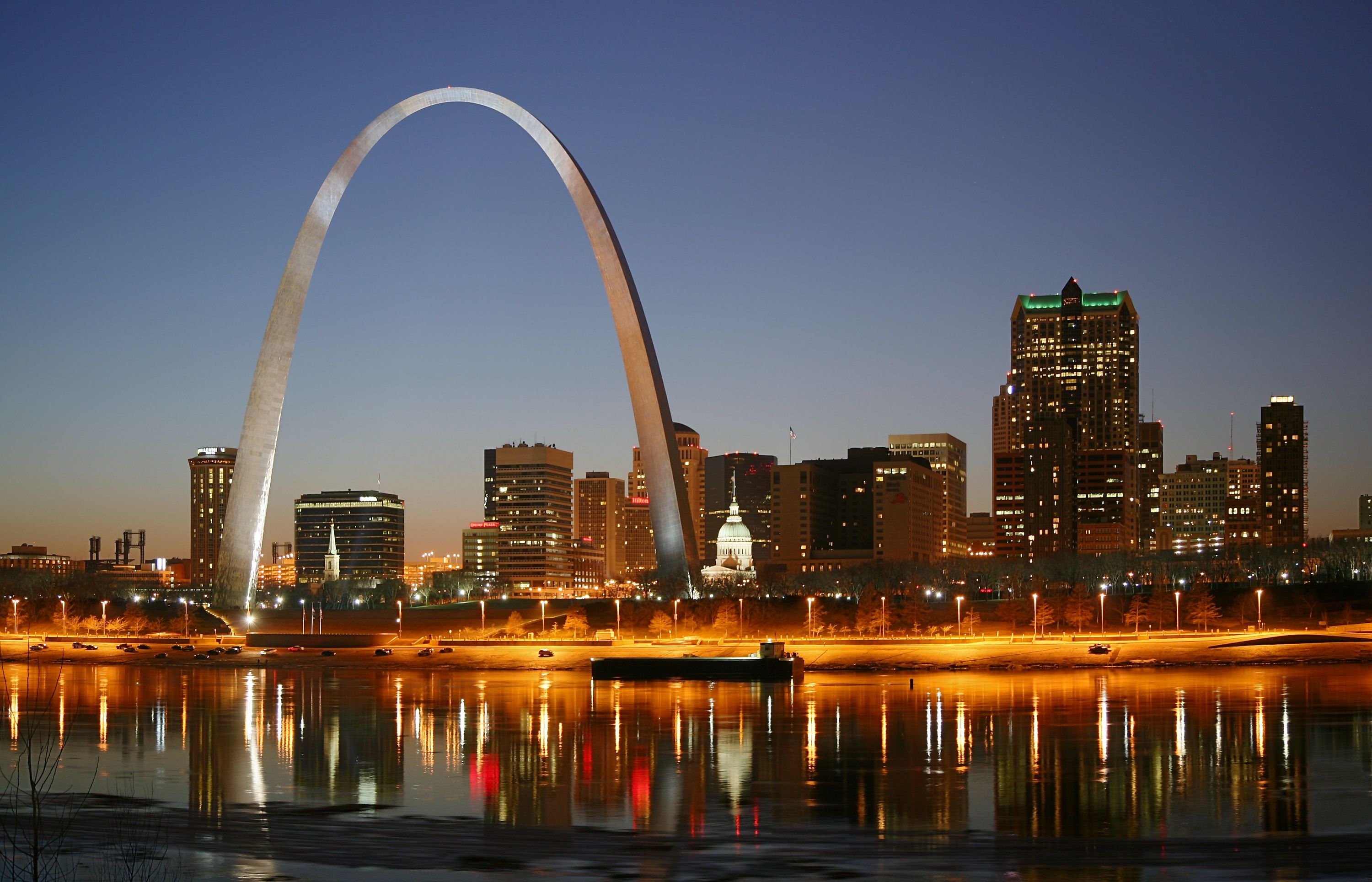 The Gateway Arch and St. Louis skyline at night.