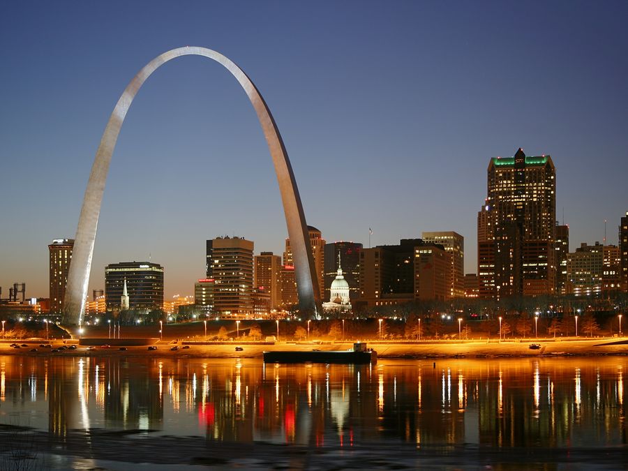 The Gateway Arch and St. Louis skyline at night.