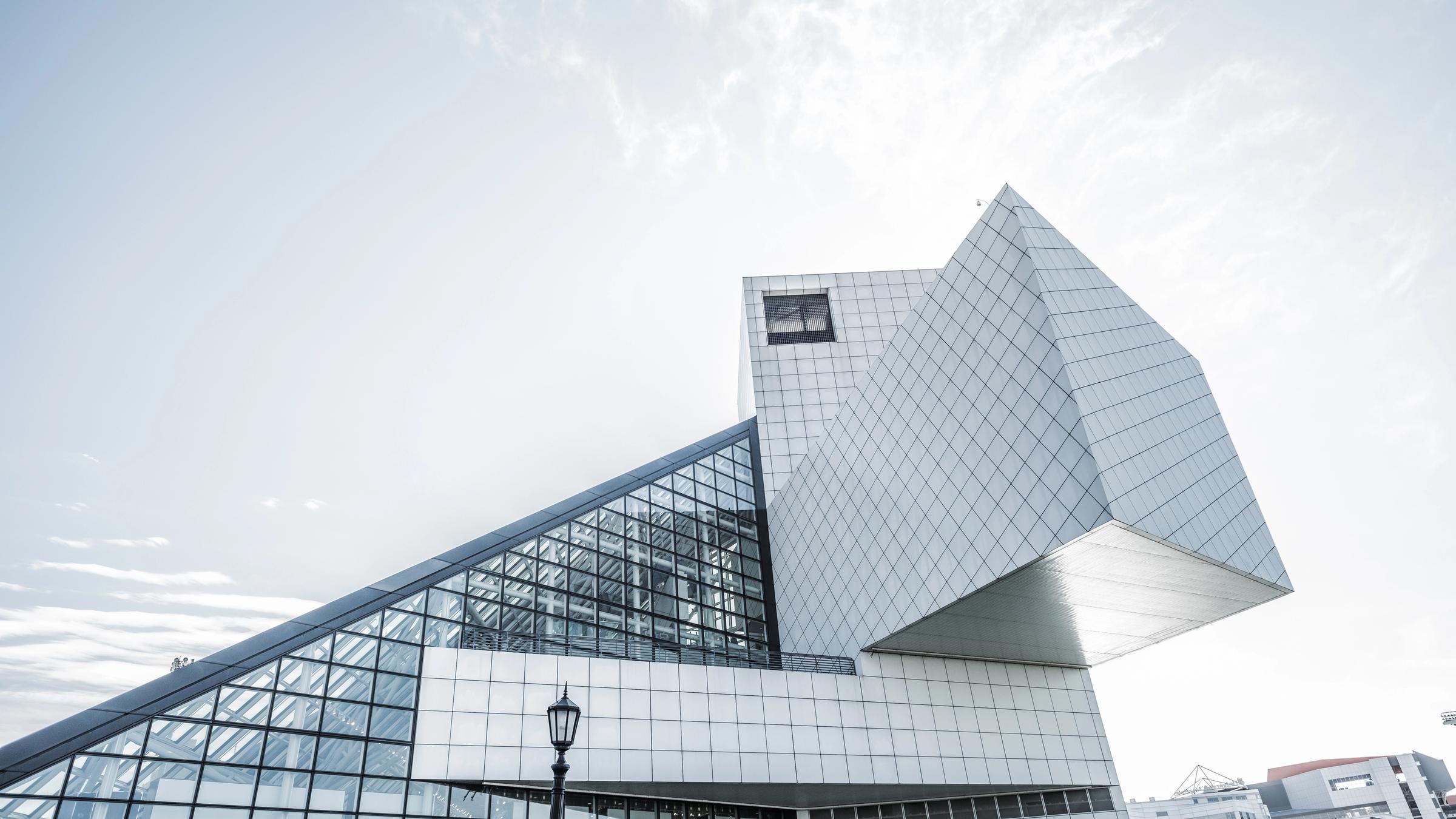 The glass pyramid of the Rock and Roll Hall of Fame on the shore of Lake Erie.