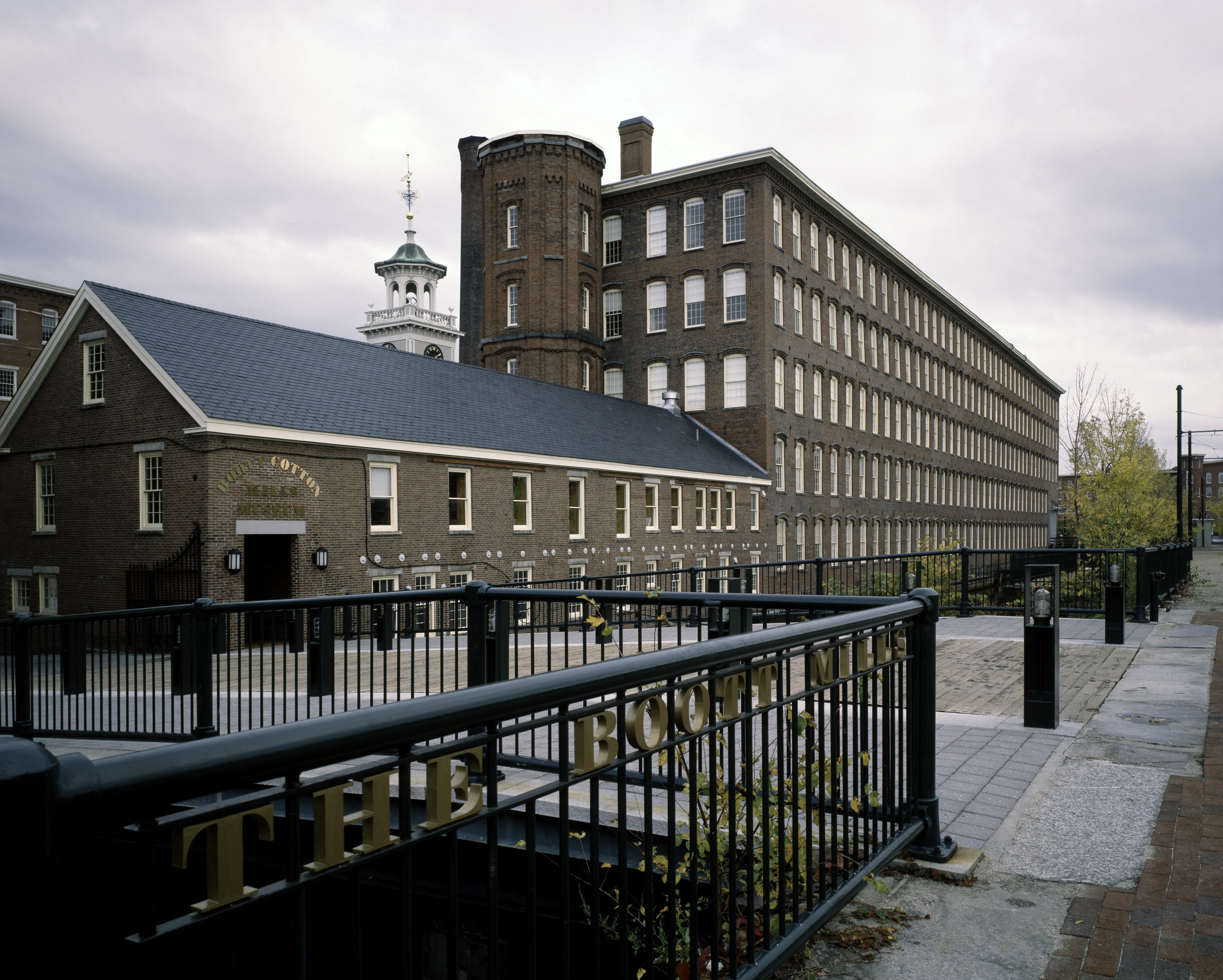 The brick Boott Cotton Mills complex along the canal in Lowell, Massachusetts.