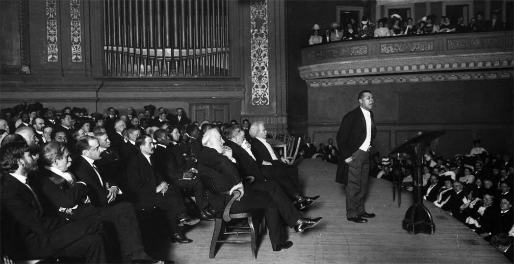A 1906 photograph of Booker T. Washington lecturing at Carnegie Hall.