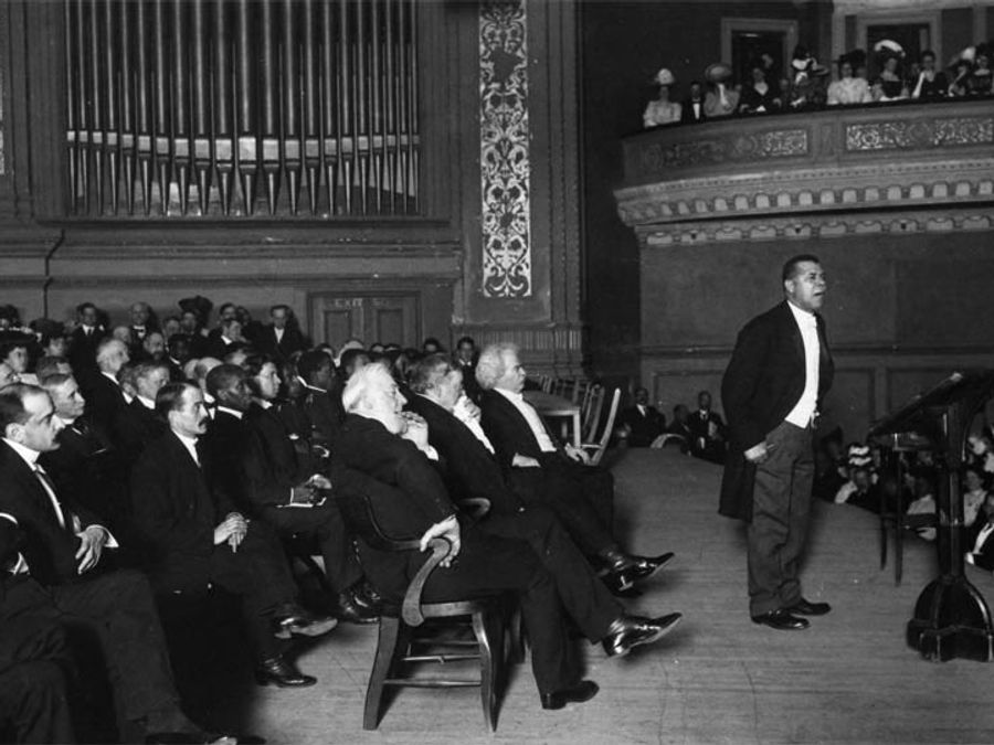 A 1906 photograph of Booker T. Washington lecturing at Carnegie Hall.