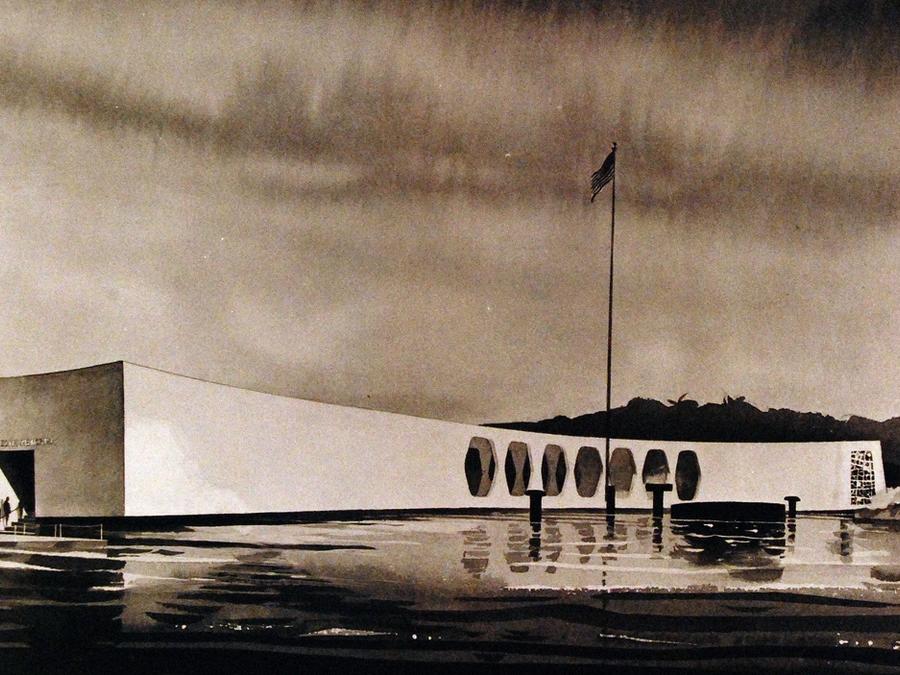 The USS Arizona Memorial spanning the sunken battleship.