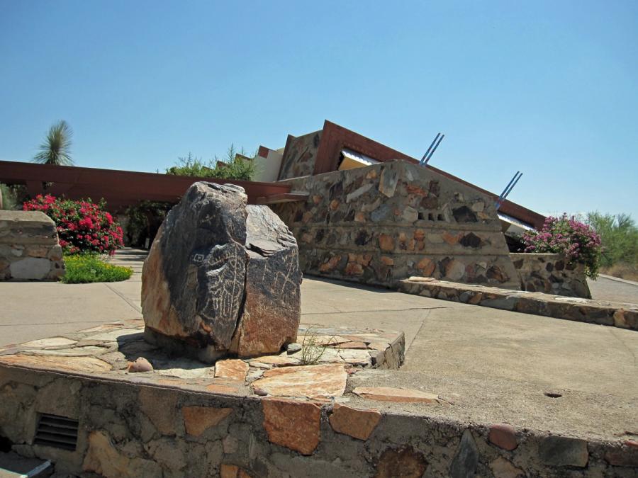 A view of the low desert-masonry buildings of Taliesin West.
