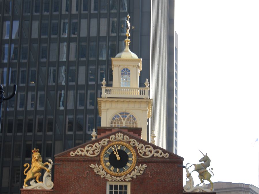 The gilded lion and unicorn, royal symbols, atop the Old State House roof.