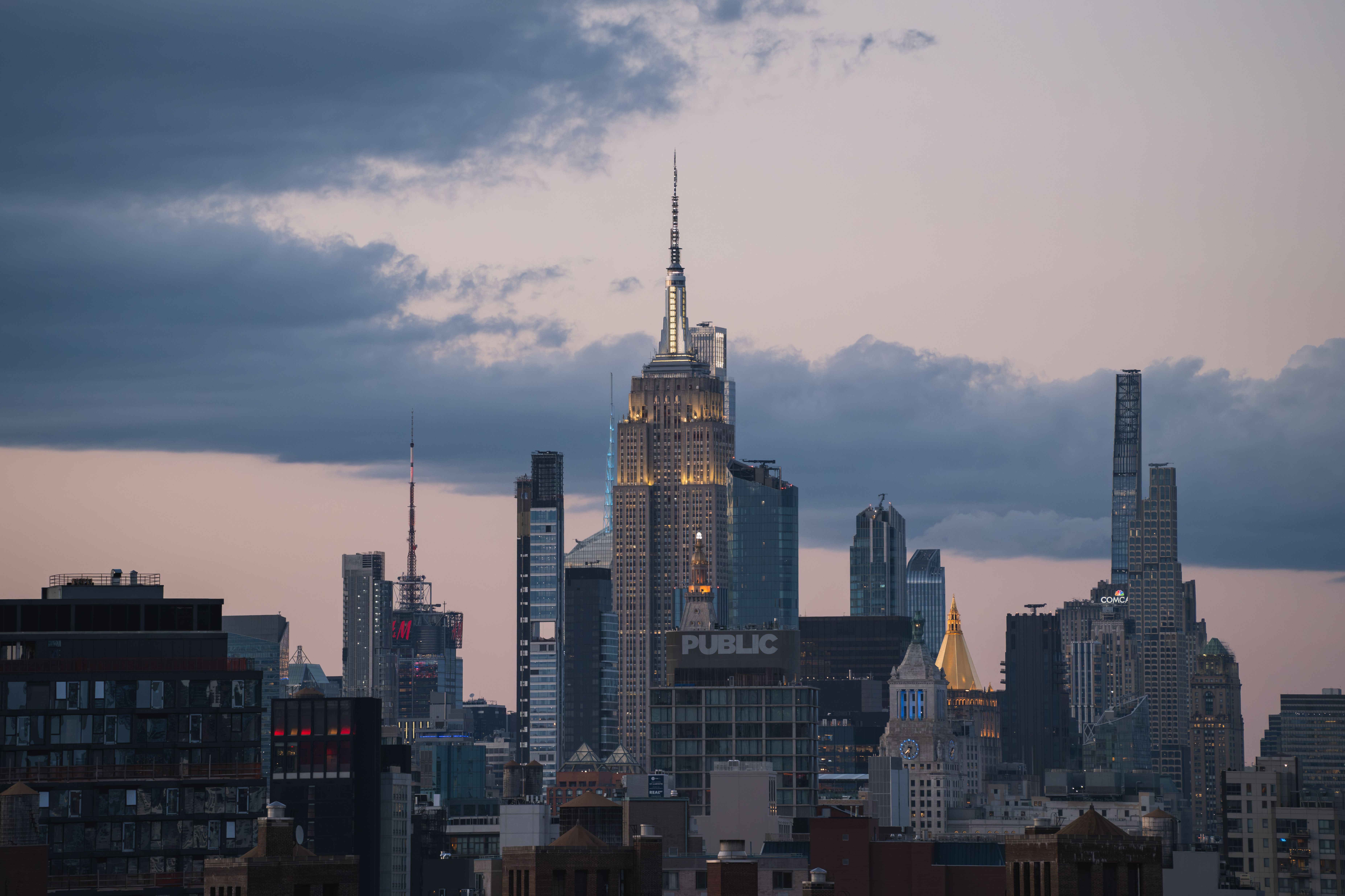 The Empire State Building at dusk, seen from the Brooklyn Bridge.