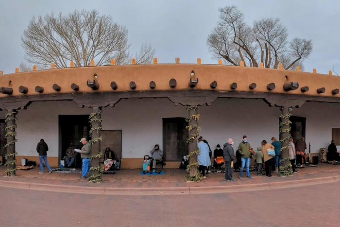 The long adobe portal of the Palace of the Governors on the Santa Fe Plaza.