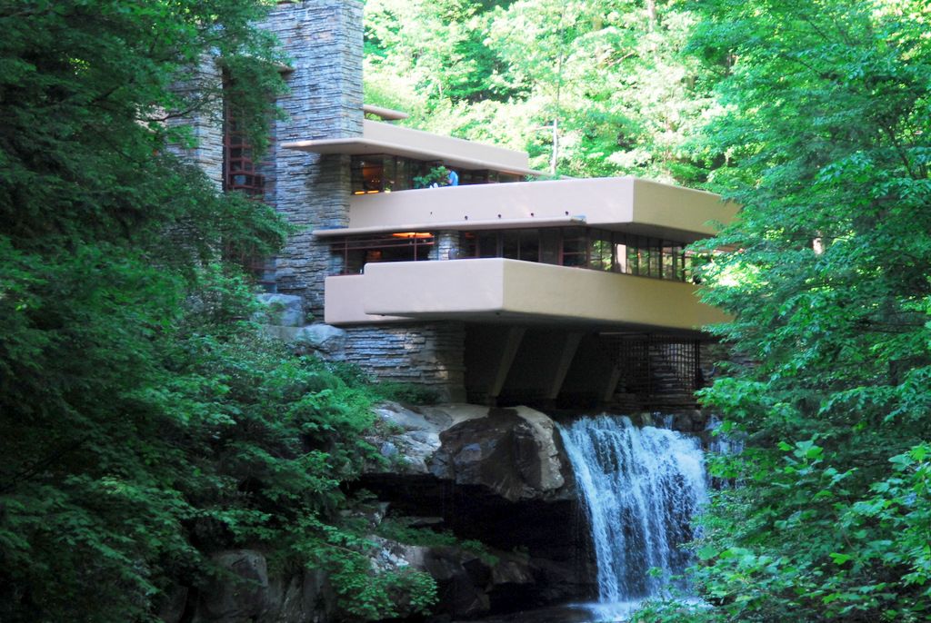 A view of Fallingwater and its concrete terraces above the stream.