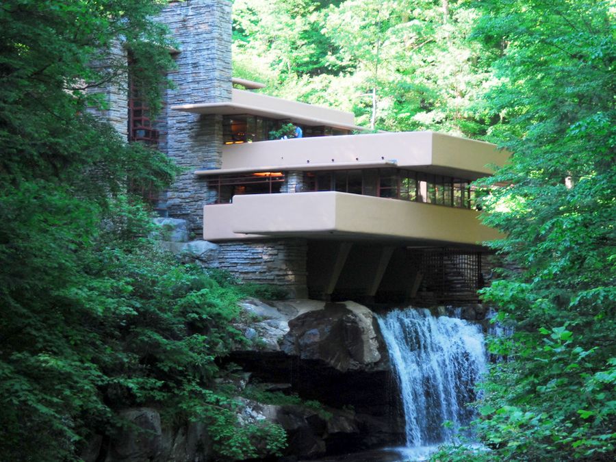 A view of Fallingwater and its concrete terraces above the stream.
