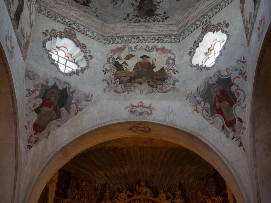 The painted apse and gilded retablo inside Mission San Xavier del Bac.