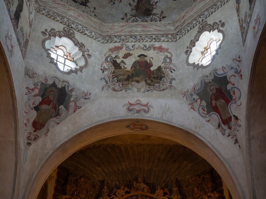The painted apse and gilded retablo inside Mission San Xavier del Bac.