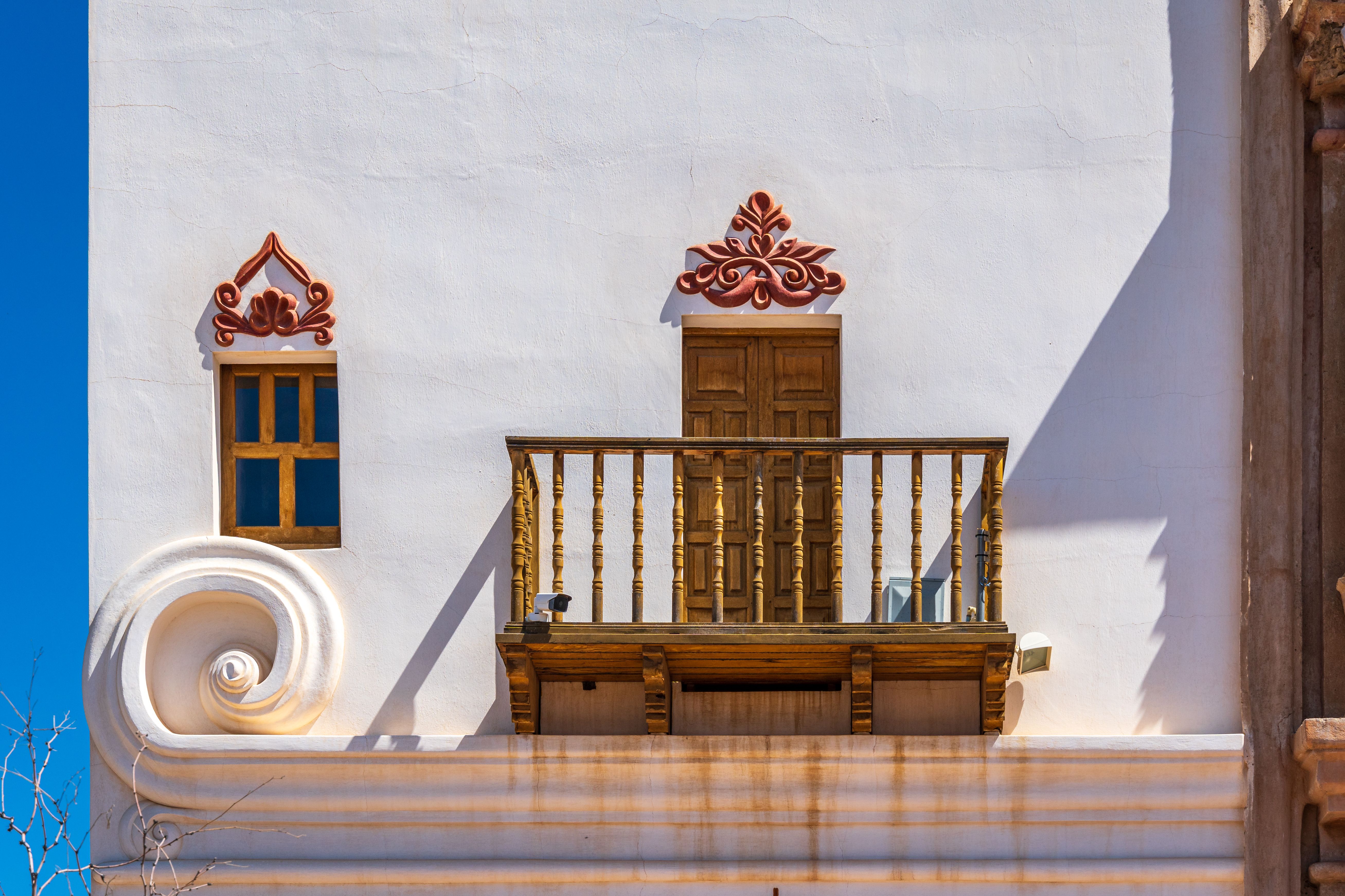 A detail view of the ornate carved facade of Mission San Xavier del Bac.