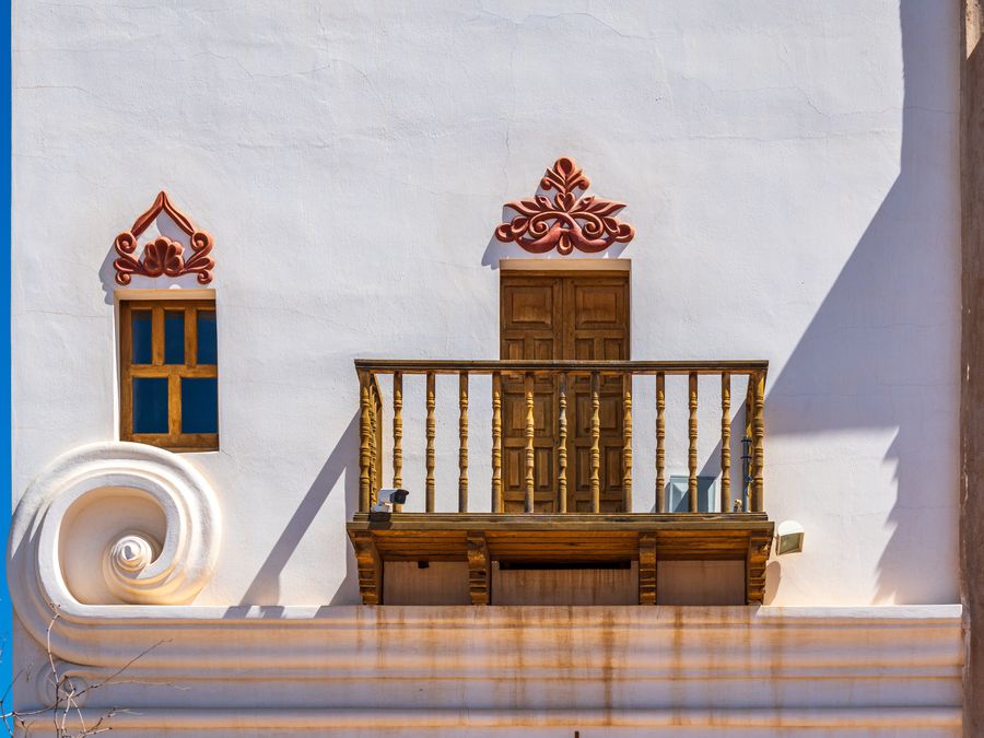 A detail view of the ornate carved facade of Mission San Xavier del Bac.