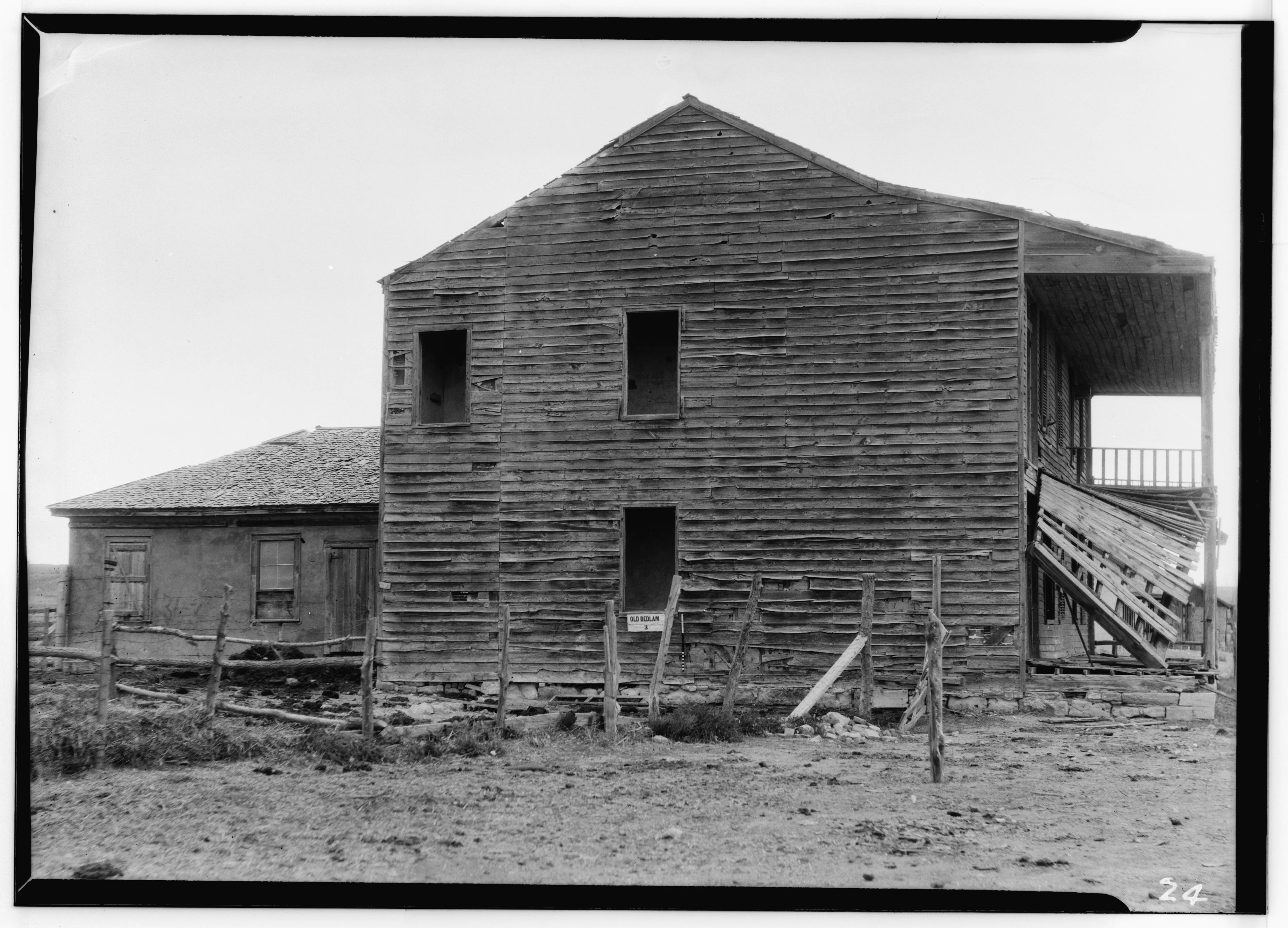 A historic documentation photograph of Old Bedlam, the officers' quarters at Fort Laramie.
