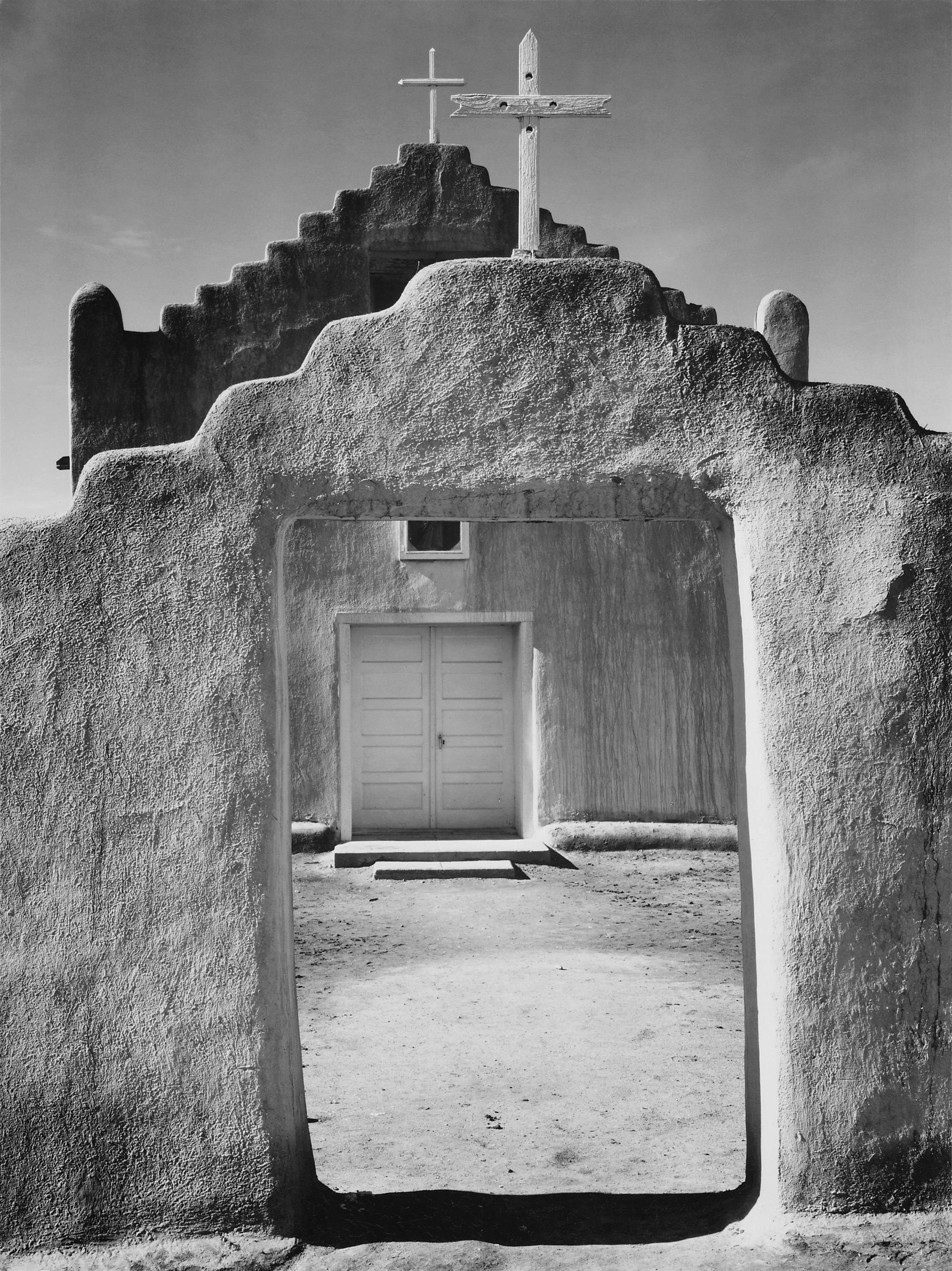Ansel Adams's 1942 photograph of the San Geronimo mission church at Taos Pueblo.