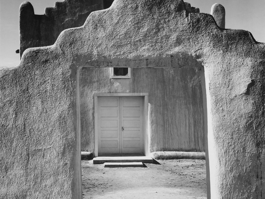 Ansel Adams's 1942 photograph of the San Geronimo mission church at Taos Pueblo.