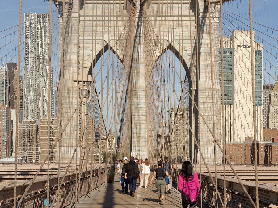 The elevated pedestrian promenade of the Brooklyn Bridge.