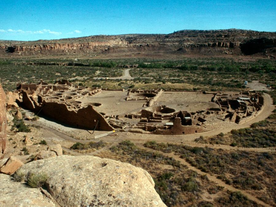 An aerial view showing the D-shaped plan of Pueblo Bonito.