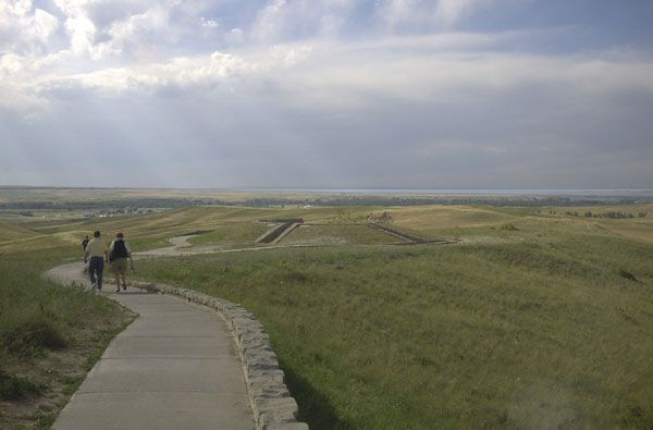 Overview of Little Bighorn Battlefield National Monument under a cloudy sky.
