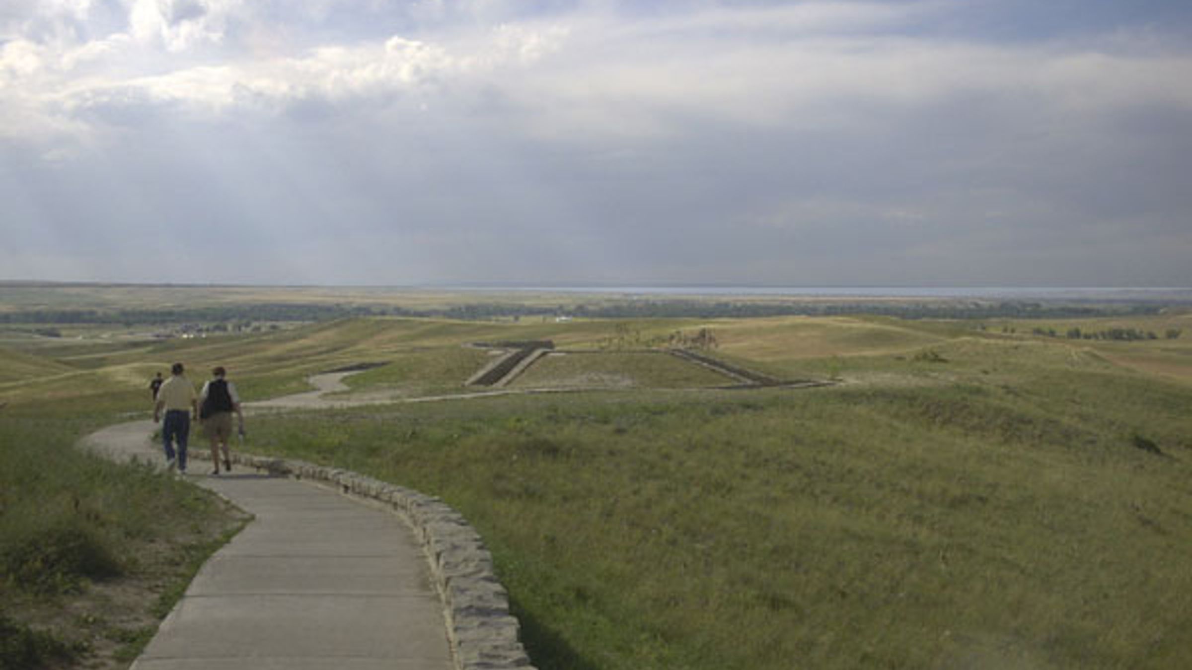 Overview of Little Bighorn Battlefield National Monument under a cloudy sky.