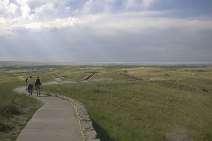 Overview of Little Bighorn Battlefield National Monument under a cloudy sky.