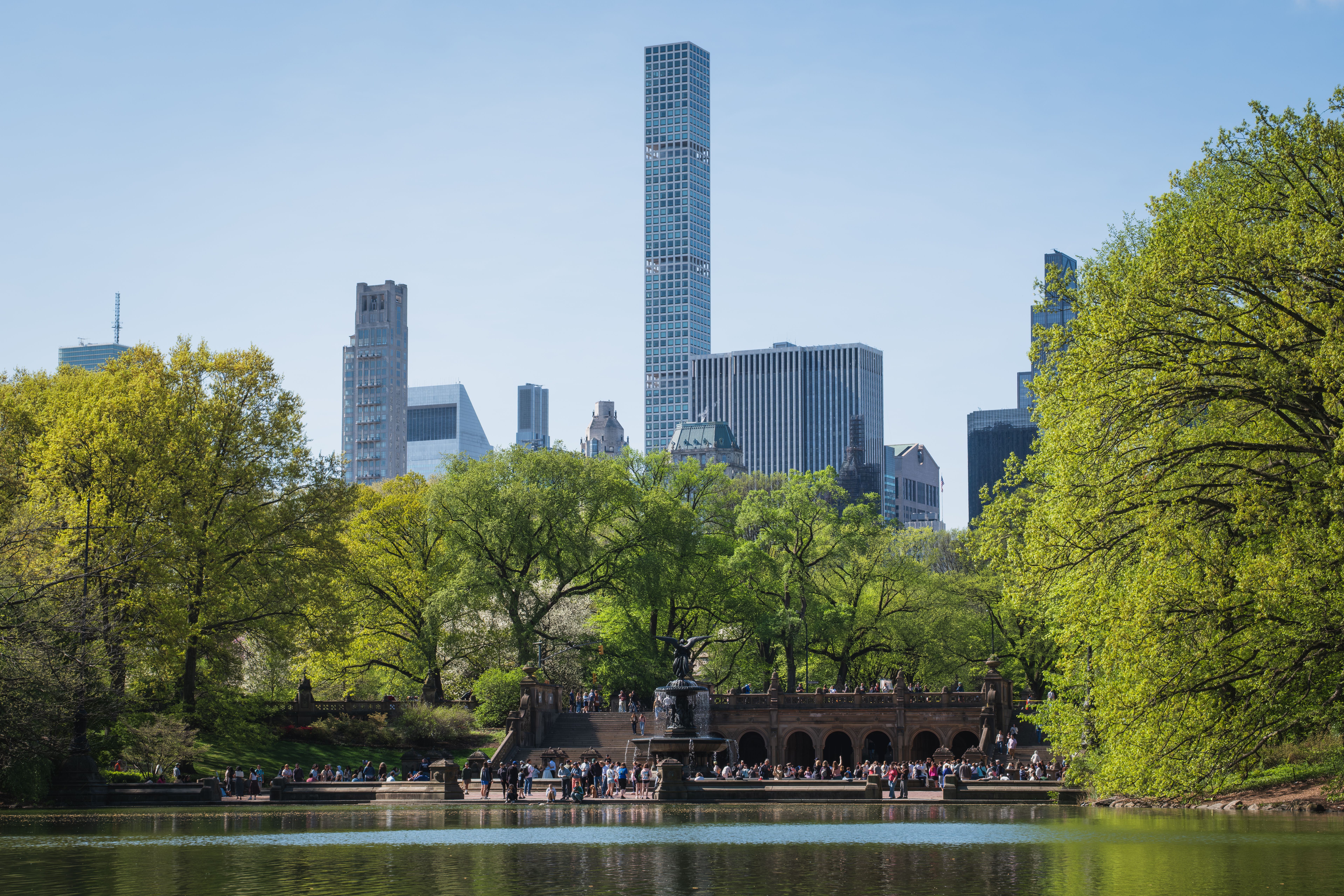 Bethesda Terrace and the lake in Central Park, with the Manhattan skyline behind.