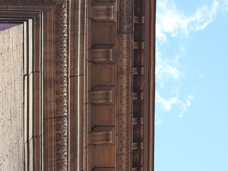 A detail of the ornate cornice on Carnegie Hall's Italian Renaissance facade.