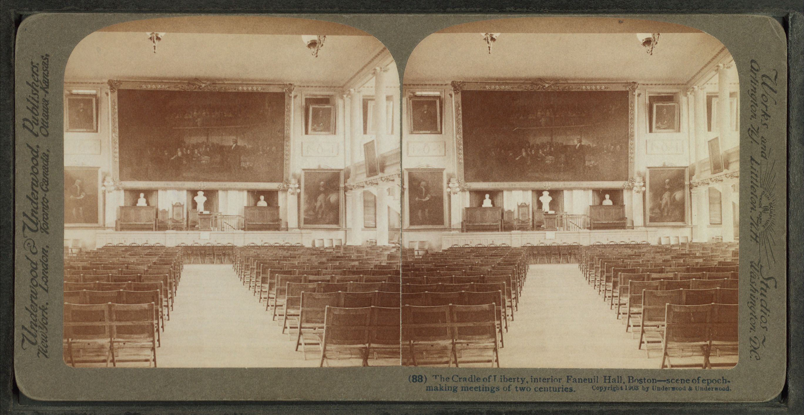 An early photograph of the interior meeting hall of Faneuil Hall.