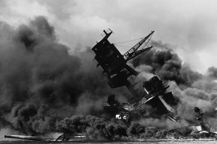 The USS Arizona burning after the Japanese attack on Pearl Harbor, December 7, 1941.
