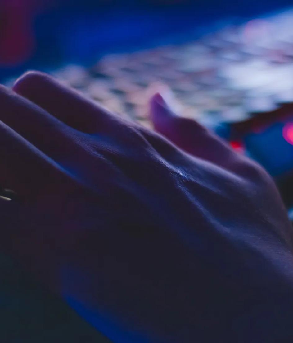 Hands on a laptop keyboard, the only input device used to walk an e-commerce checkout end to end during an accessibility pass