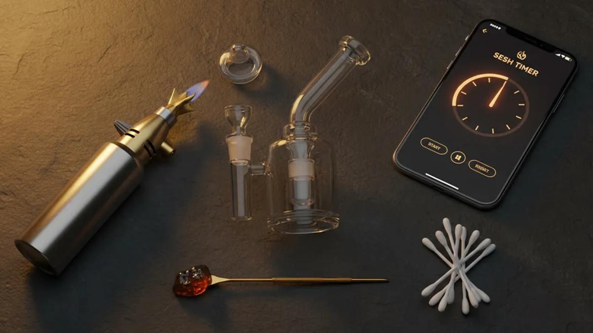 Complete dab setup flat-lay with rig, banger, torch, and accessories