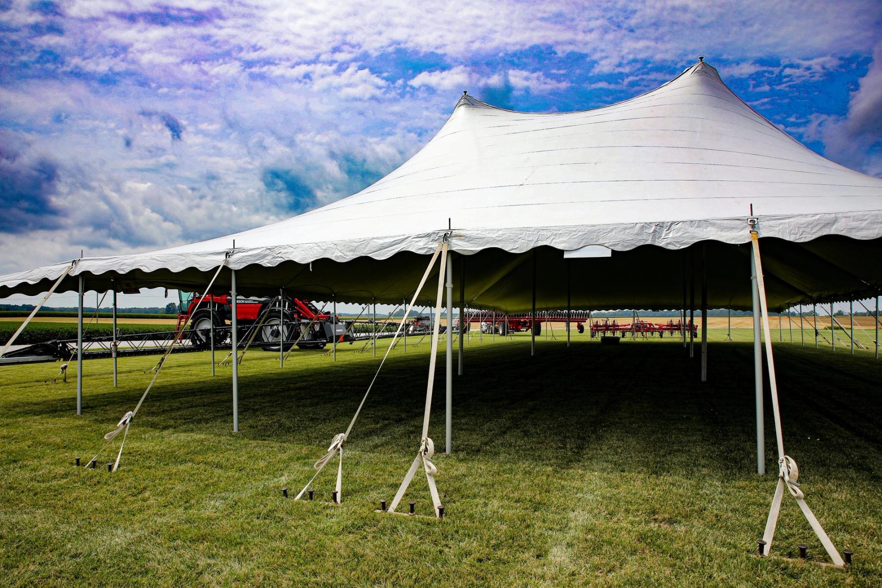 Backyard party tent setup with tables and chairs in Caldwell New Jersey