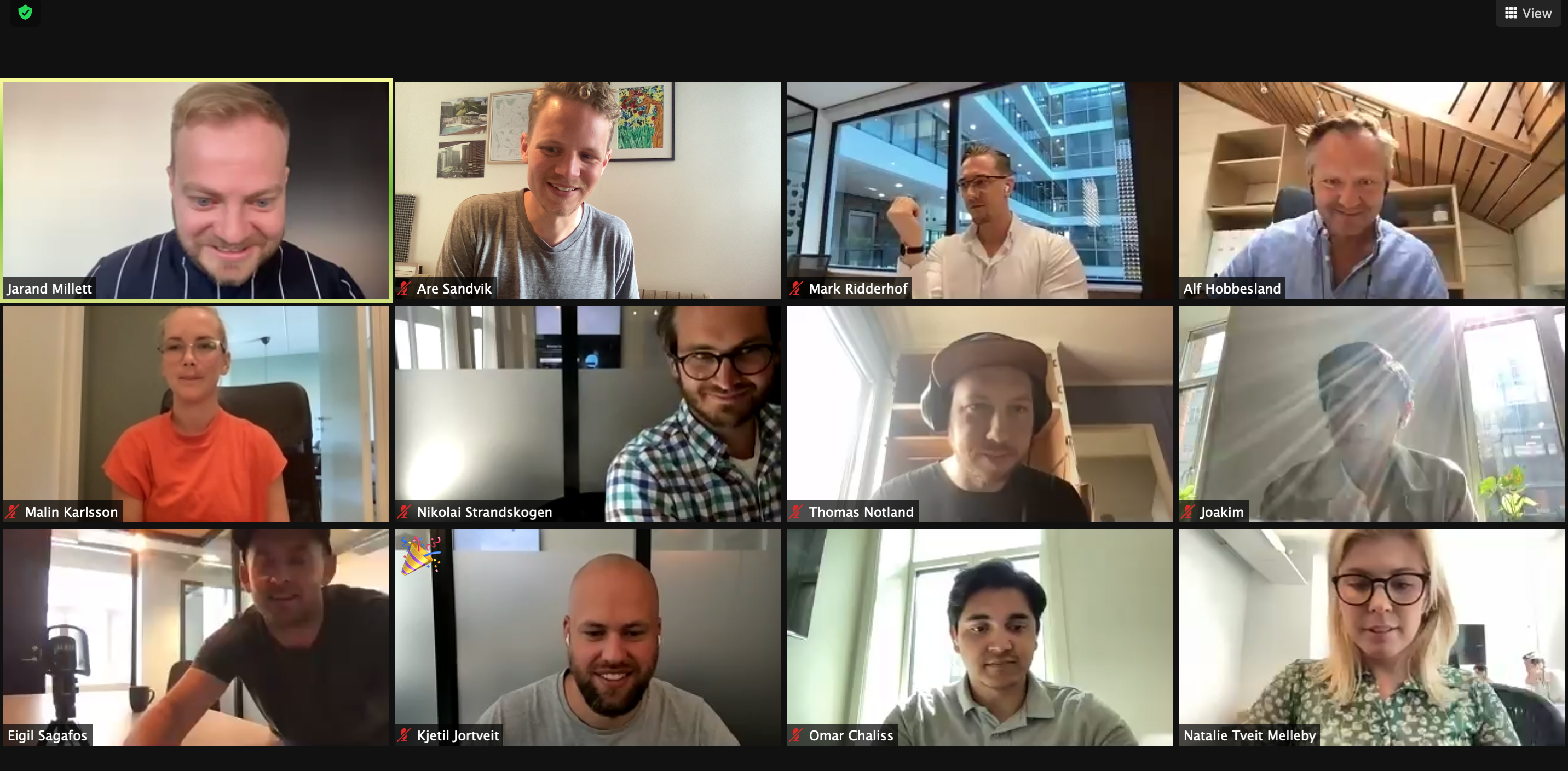 A screenshot of a video conference meeting with 12 ShiftX employees
