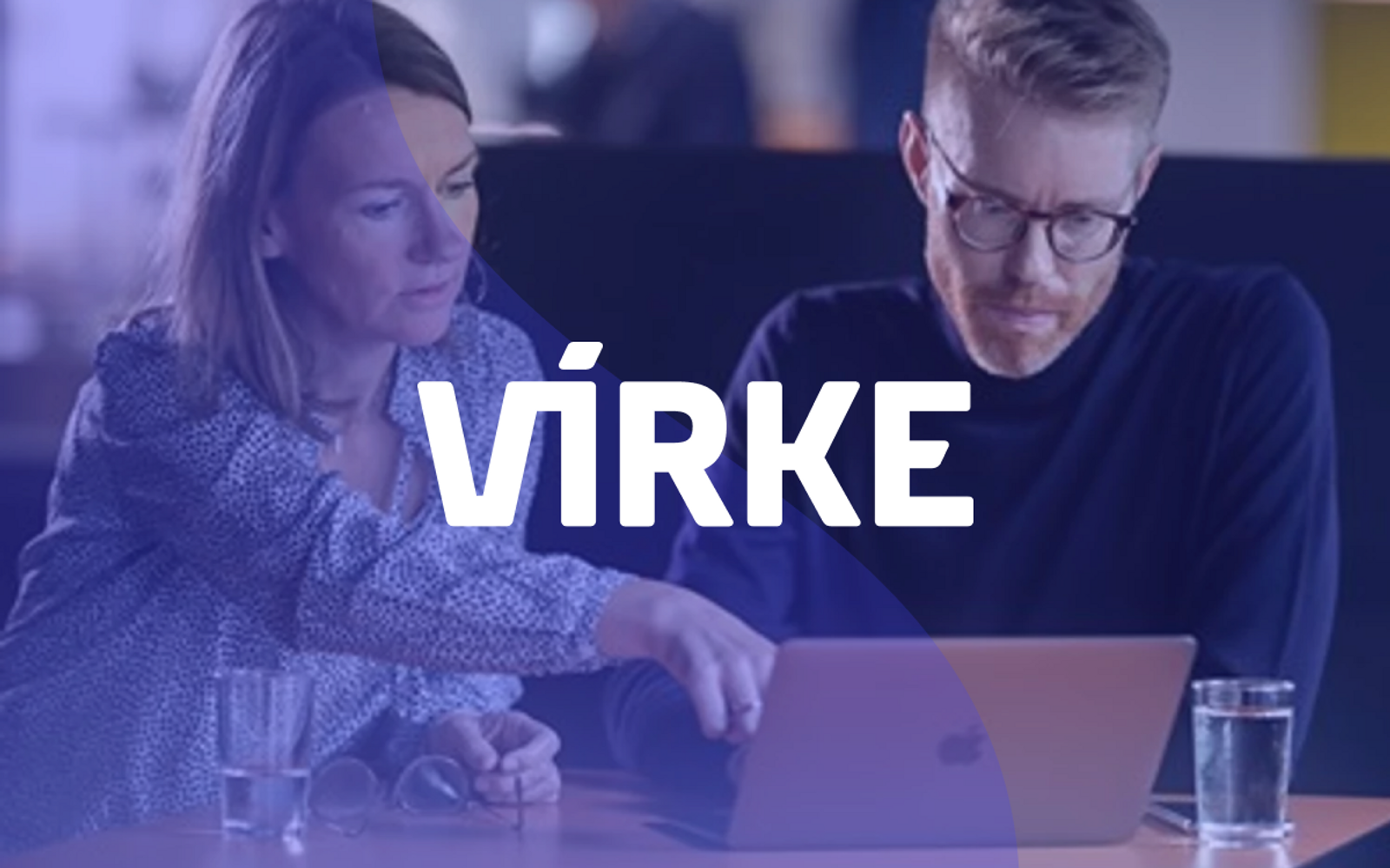 Two people looking at a lap top screen, with blue transparent overlay and the Virke logo over it