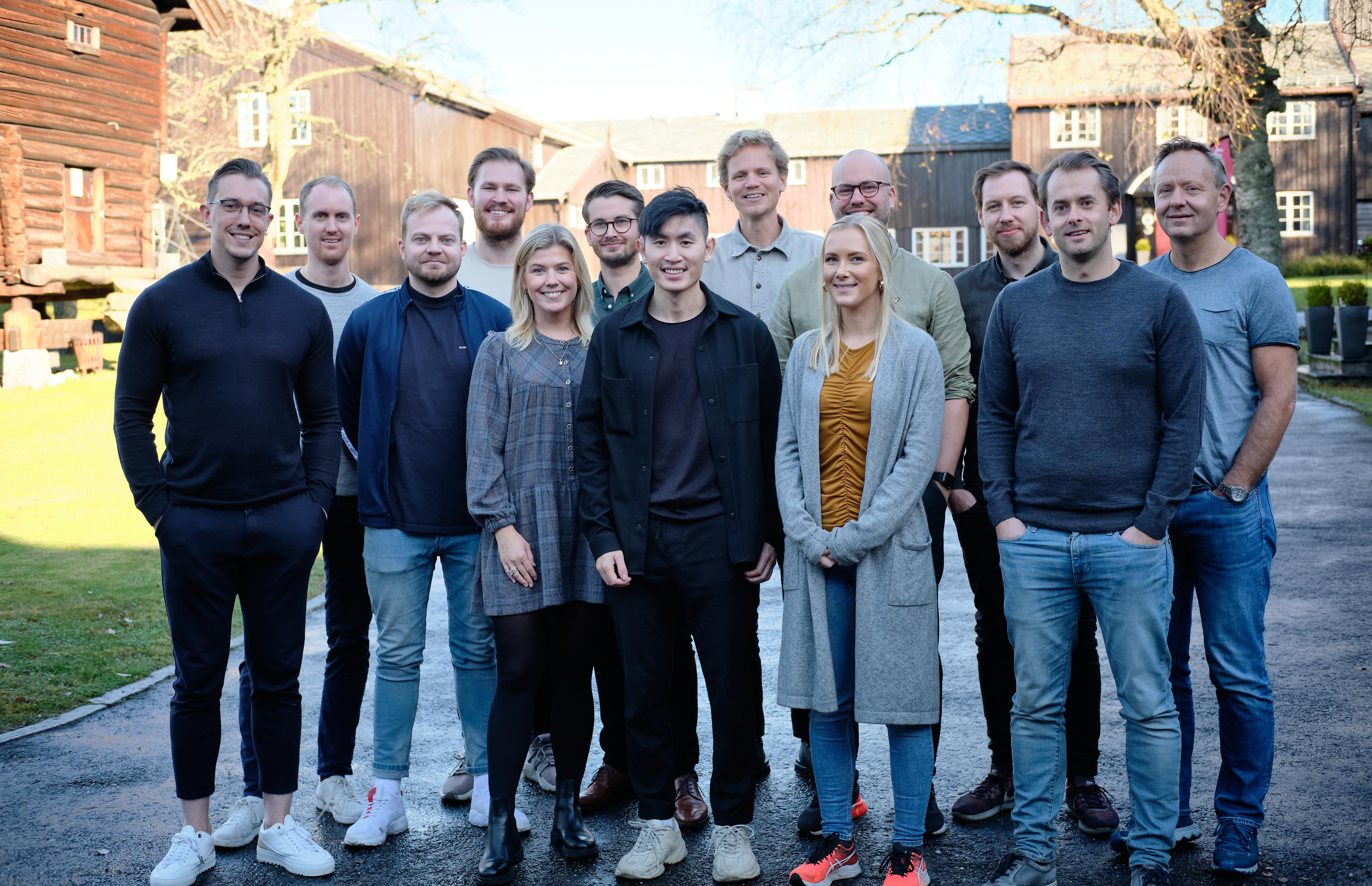 A team picture of 13 ShiftX employees at Lysebu, Oslo