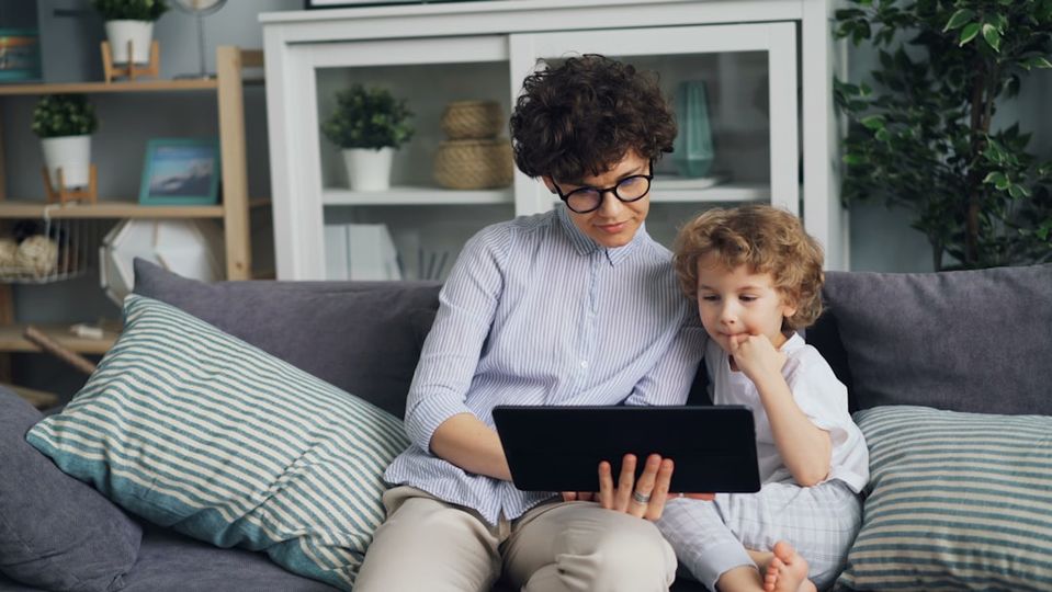 Parent and child reviewing math progress on AI learning platform dashboard