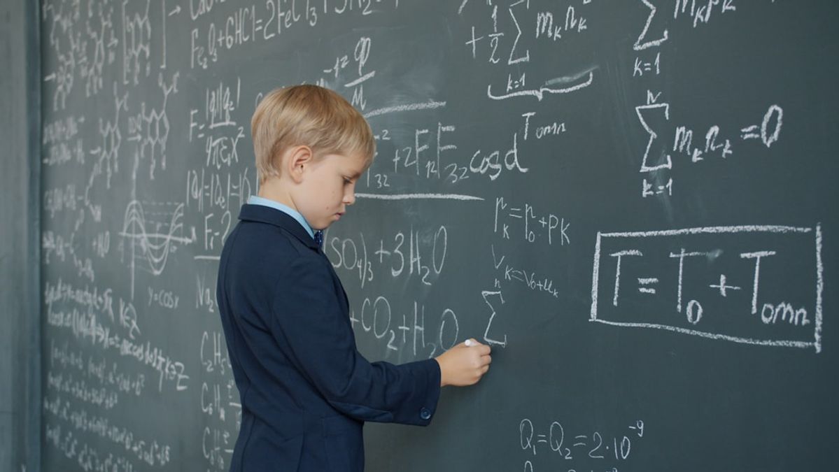 Parent helping child with math homework showing signs of math struggles and support strategies