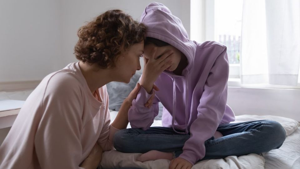 A mother has a hard talk with her daughter.
