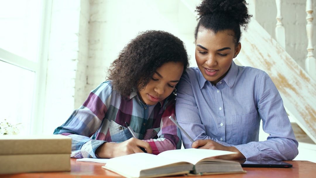 Confident parent showing supportive gestures while child works on math problems