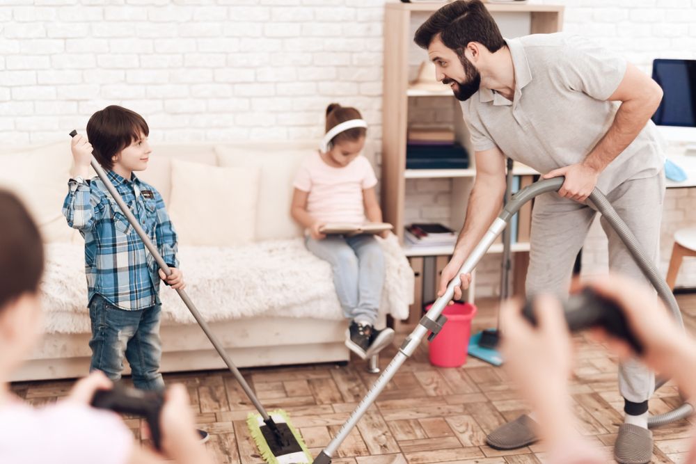 A family cleans their house together.