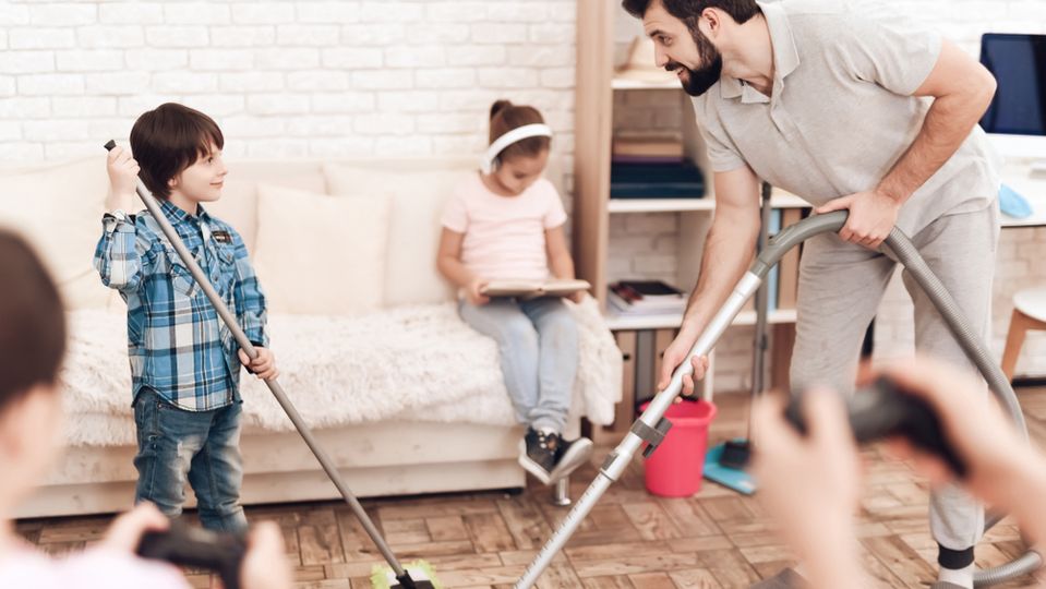 A family cleans their house together.
