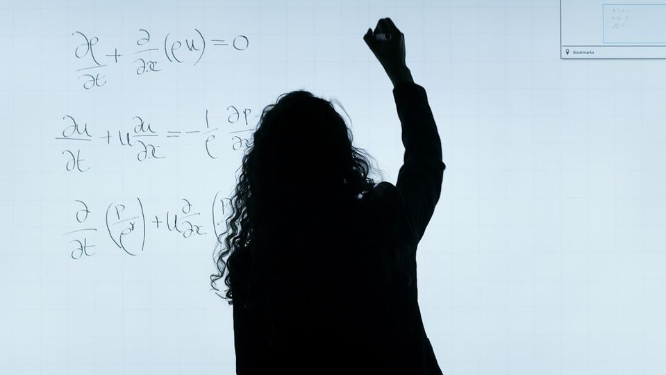 Students working with data visualization and mathematical concepts on computers, showing future math skills 2026