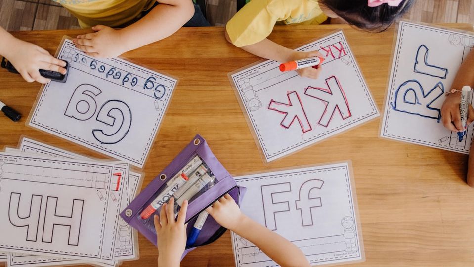 Illustration of basic arithmetic concepts with children learning addition, subtraction, multiplication, and division