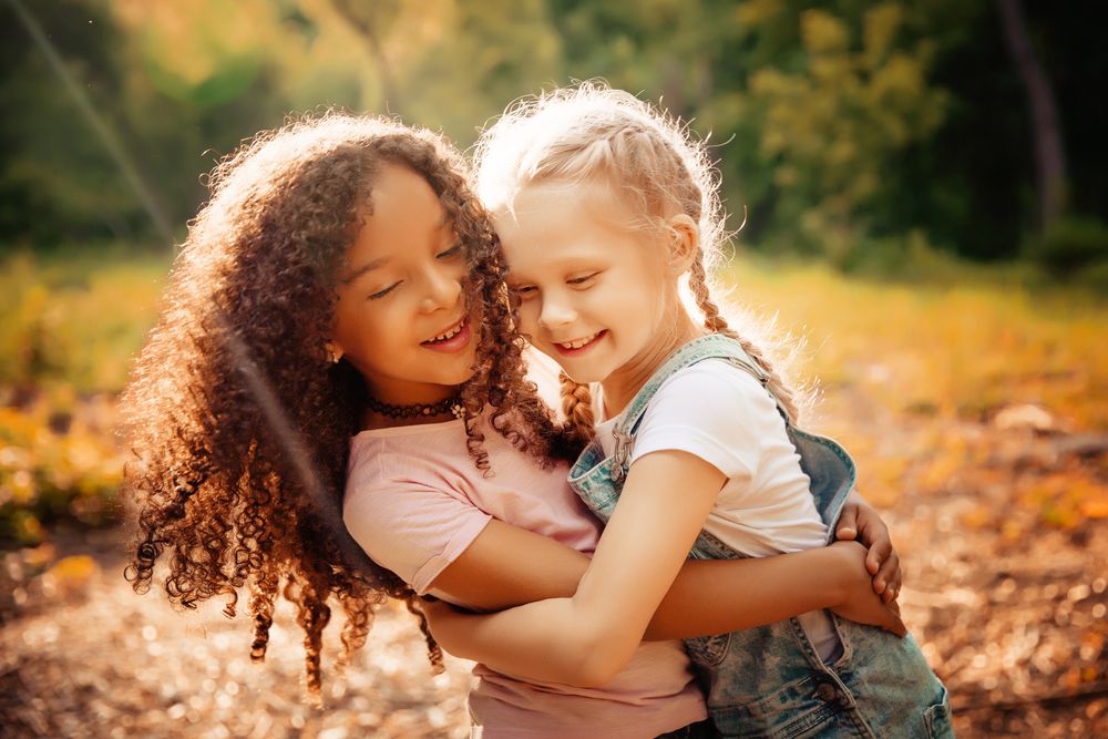 Two young girls hugging