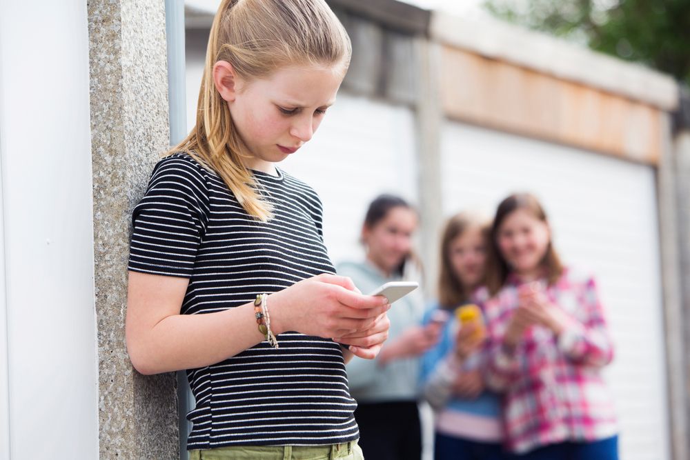 A young girl is bullied at school.
