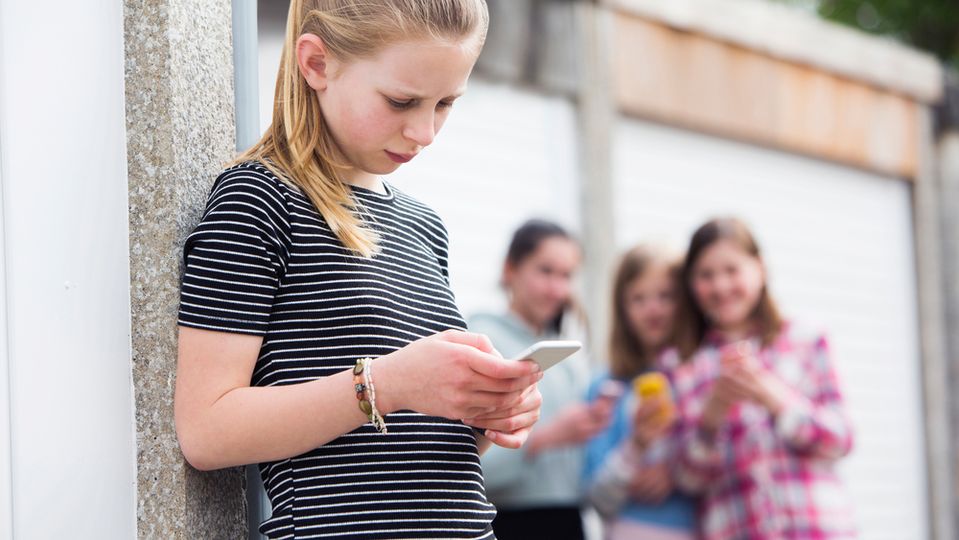 A young girl is bullied at school.