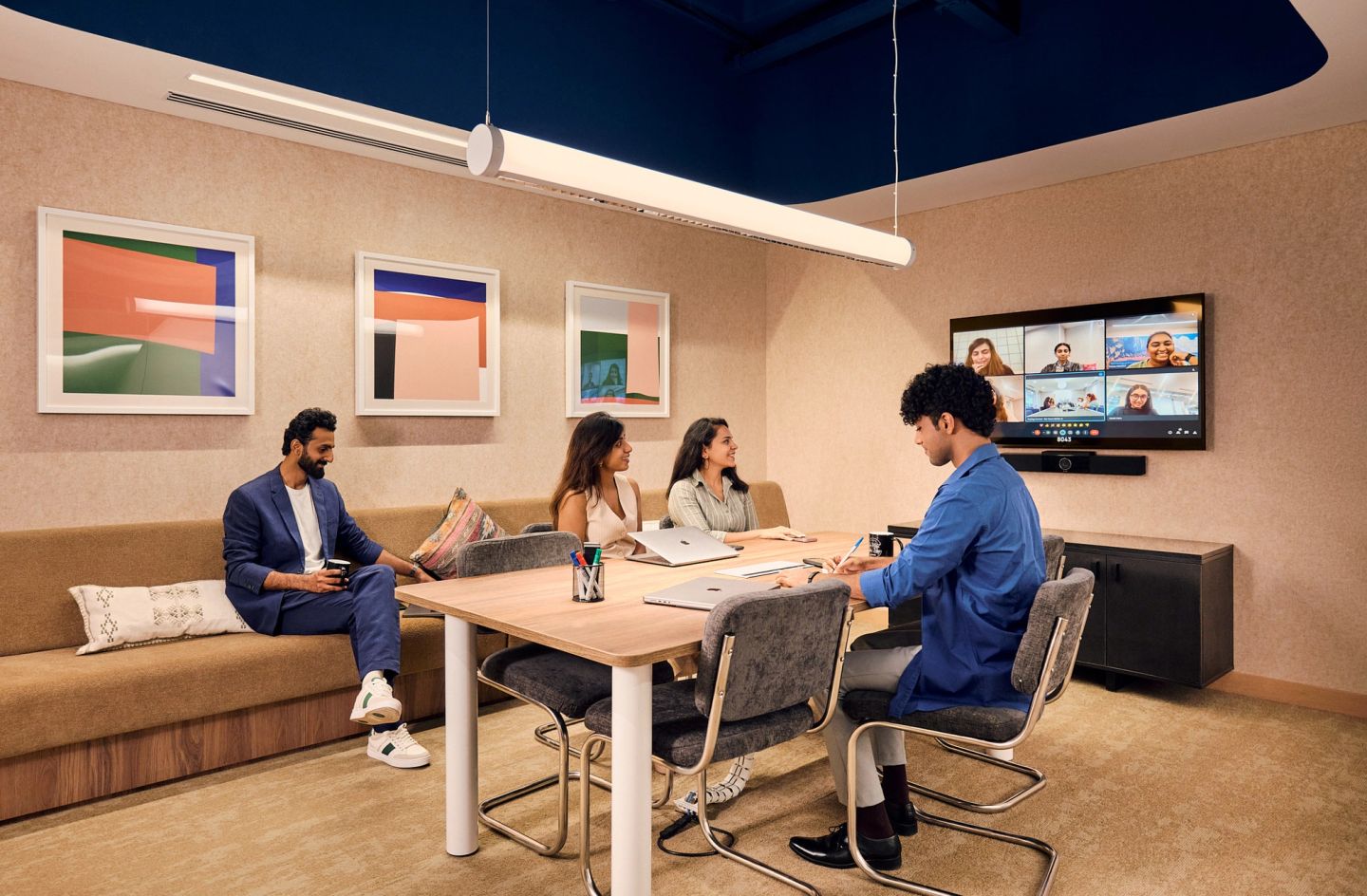 Team brainstorming around a whiteboard in a WeWork meeting room