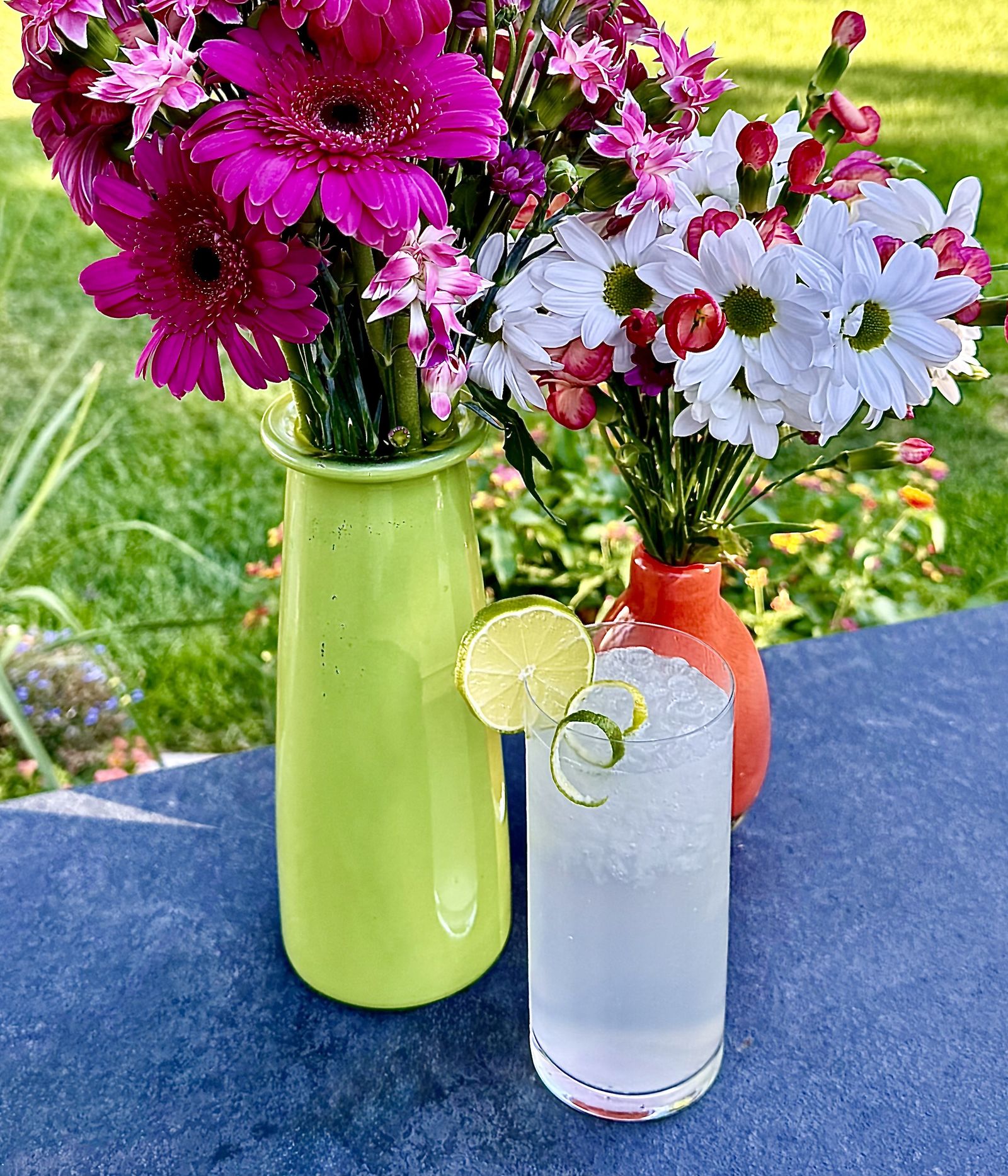 A tall lime drink with sparkling water and plenty of ice