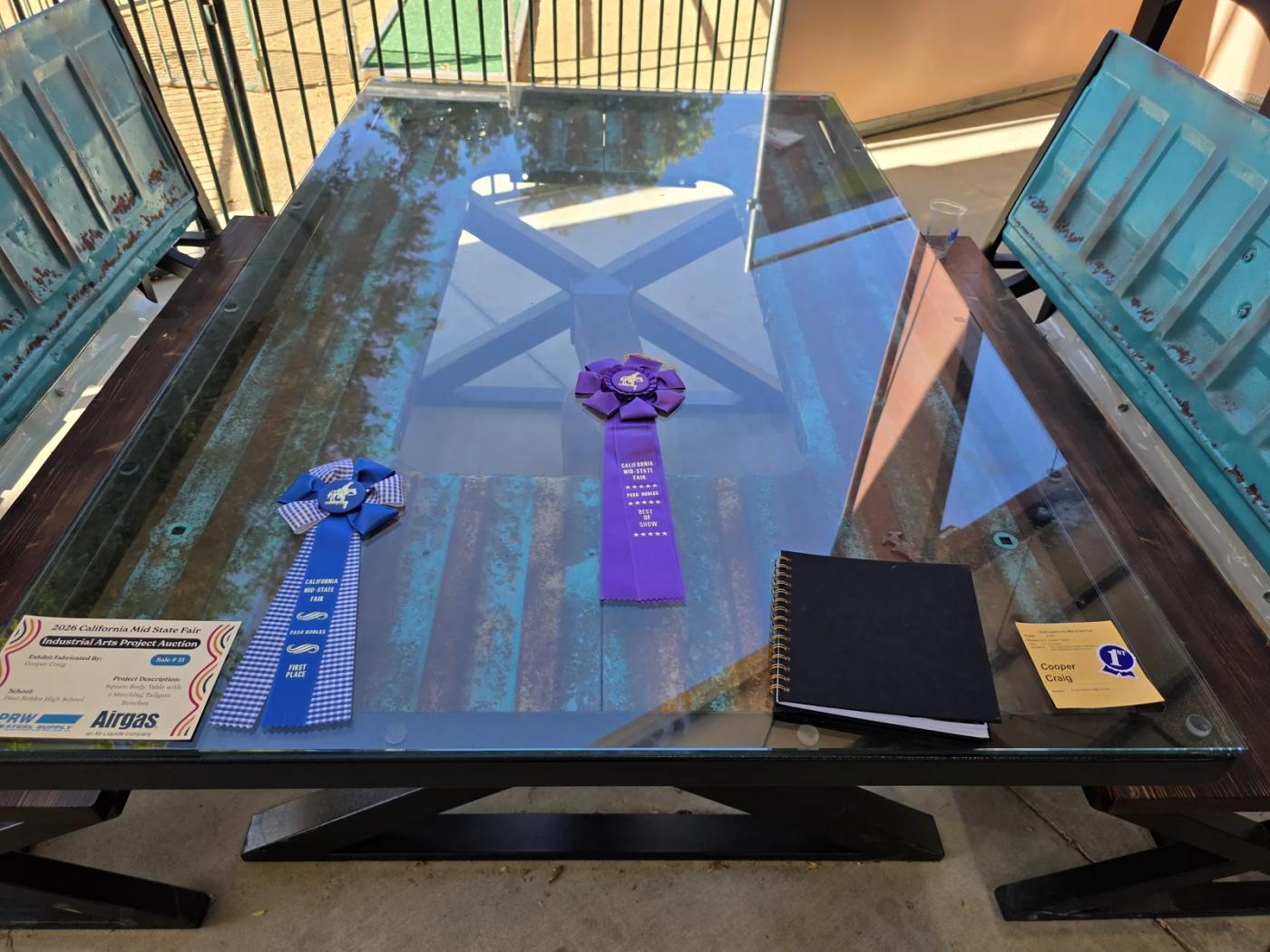 Award-winning student-built table and chairs made with square-body truck panels and tailgate parts